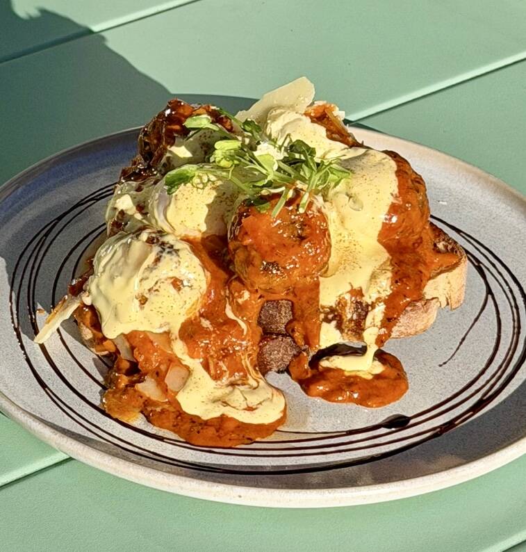 Café Eighty2’s Volcano Meatball Benedict with hollandaise
