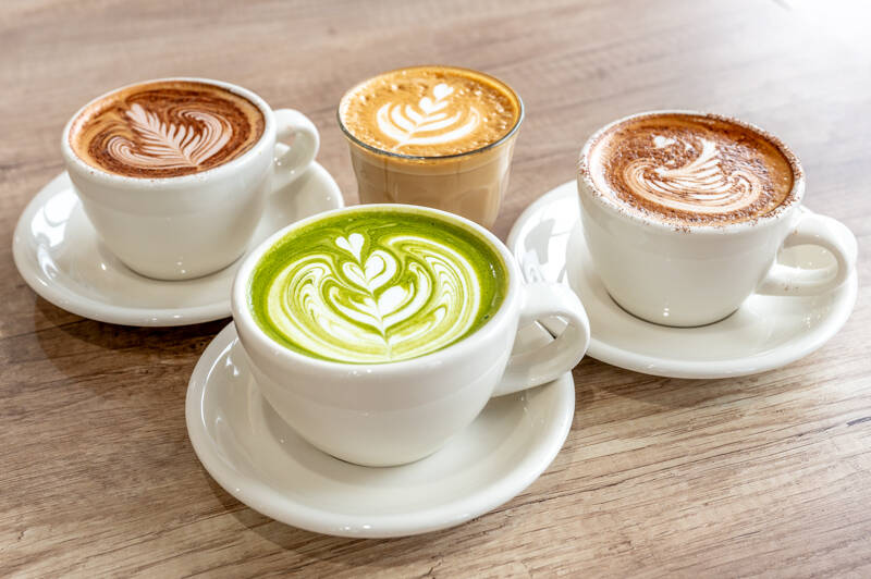 Coffee and matcha with latte art at Café Eighty2