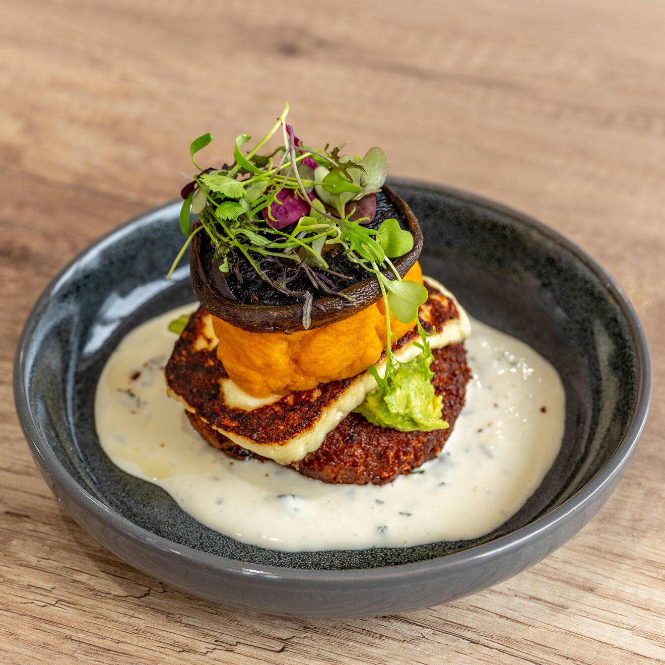 Potato Stack with mushroom, halloumi and fresh greens